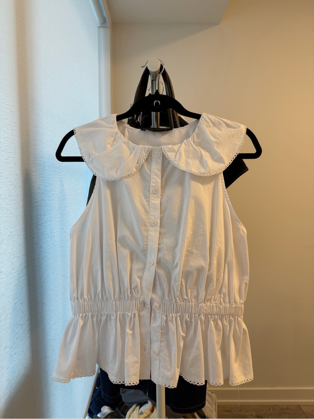 White Sleeveless Button-Front Peplum Blouse with Peter Pan Collar